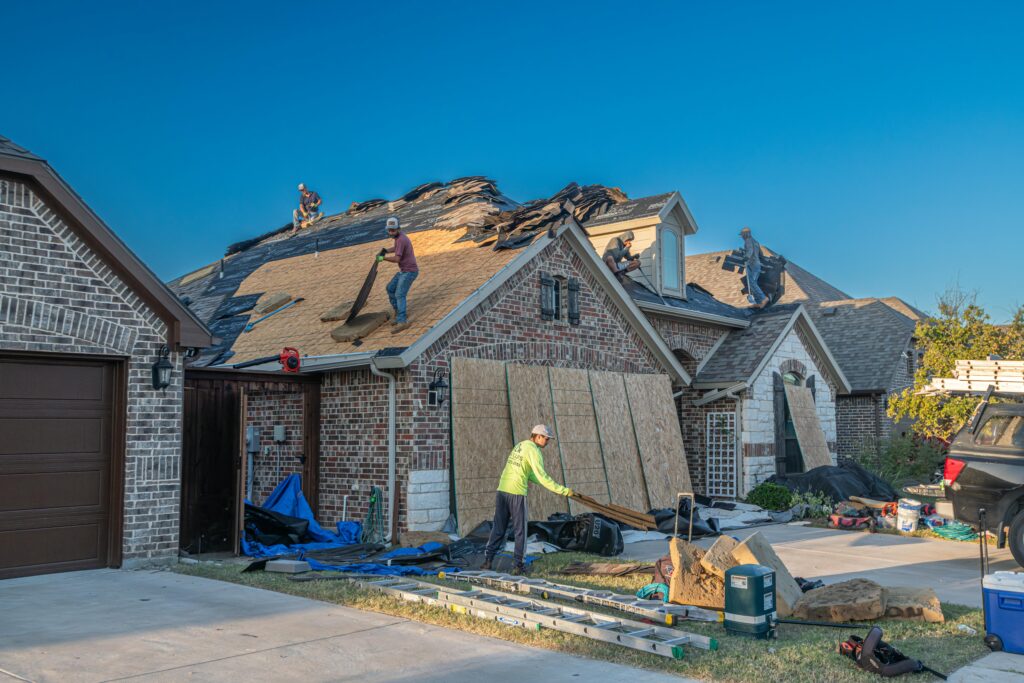 pexels photo 33404981 33404981 Workers engage in roof replacement on a brick house in Fort Worth, Texas.